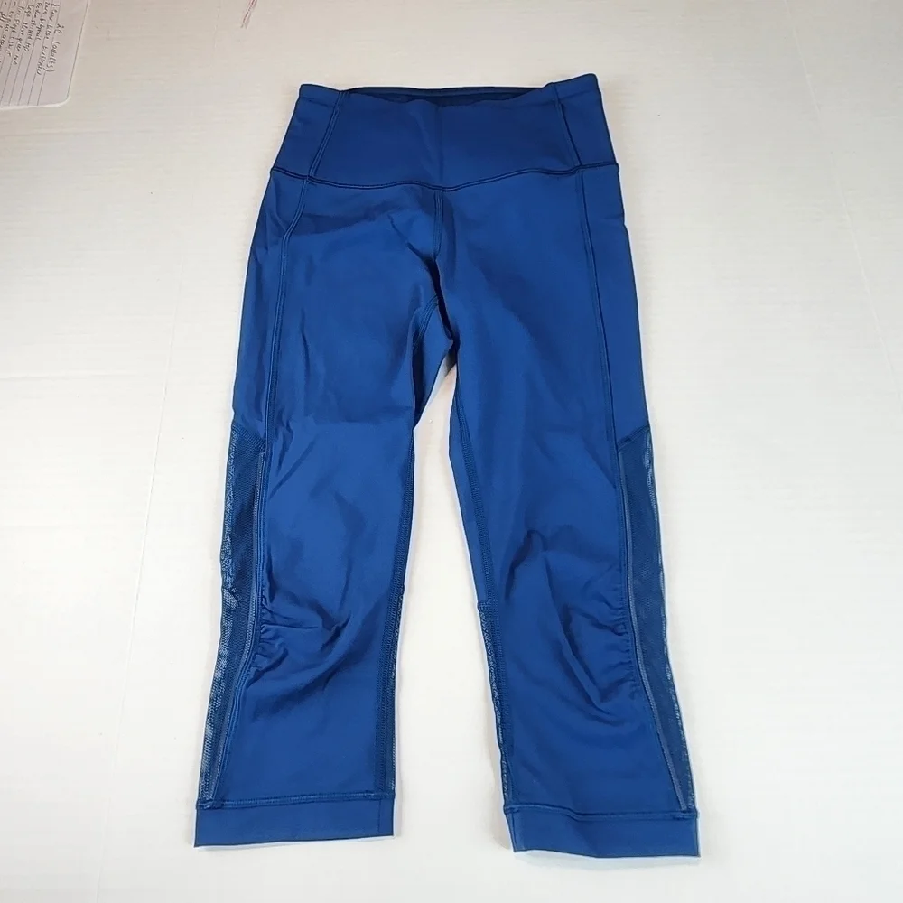 Lululemon size 2 Gear up blue Poseidon cropped leggings with sheer accents